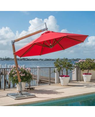 small cantilever parasol with red canopy and rotating base on pool side